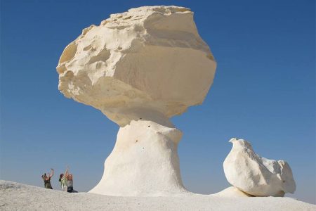 mushroom-shaped chalk rock formation standing prominently in the White Desert of Bahariya Oasis